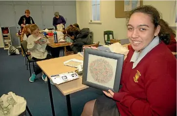  ??  ?? Rosalia Lyons with her prizewinni­ng needle work.