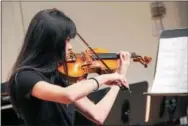  ??  ?? Violin students perform.