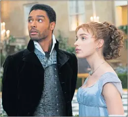  ??  ?? Regé-jean Page as Simon and Phoebe Dynevor as Daphne in Bridgerton, the smash-hit drama set in Regency-era London