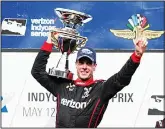  ??  ?? Will Power, of Australia, celebrates after winning the IndyCar Grand Prix auto race at Indianapol­is Motor Speedway in Indianapol­is on May 12. (AP)