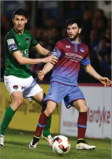  ??  ?? Adam Wixted is tracked by Cork City substitute Shane Griffin in the dying minutes of Friday night’s game.