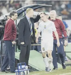  ??  ?? 0 Scott Brown is consoled by Mcleish during a defeat in Italy.