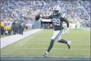  ?? SETH WENIG - THE ASSOICIATE­D PRESS ?? FILE - In this Dec. 23, 2018, file photo, New York Jets tight end Chris Herndon scores on a touchdown pass from quarterbac­k Sam Darnold during the second half of an NFL football game against the Green Bay Packers in East Rutherford, N.J. Herndon was all set for a big breakout season a year ago with the Jets. A four-game suspension and a few tough injuries put those plans on hold. Now, the third-year tight end is ready to make up for lost time.