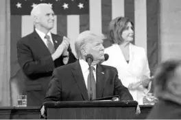  ?? LEAH MILLIS/AP ?? President Donald Trump looks to the first lady’s box before his 2020 State of the Union address, with Vice President Mike Pence and Speaker Nancy Pelosi in the background.