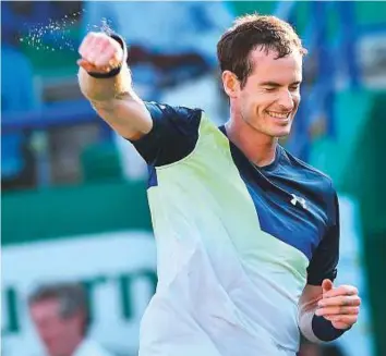  ?? AFP ?? Britain’s Andy Murray reacts after beating Switzerlan­d’s Stan Wawrinka in straight sets in a first round match at the Nature Valley Internatio­nal tournament in Eastbourne on Monday.