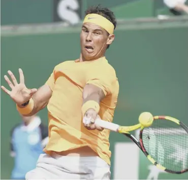  ??  ?? 0 Rafael Nadal hits a forehand during his win over Aljaz Bedene in the second round in Monte Carlo.