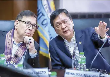  ?? PHOTO FROM DOF ?? Finance Secretary Ralph Recto (left) and Insurance Commission chief Reynaldo Regalado discuss strategic plans to strengthen the country’s insurance industry and broaden coverage.