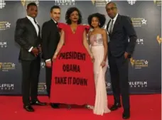  ?? MARK BLINCH/REUTERS ?? Aunjanue Ellis wore a dress with a slogan protesting the flying of the Confederat­e flag when she attended the Canadian Screen Awards.