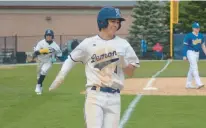  ?? JEFF VORVA/DAILY SOUTHTOWN ?? Lemont’s Brett Tucker smiles as he crosses home plate with the winning run against Sandburg during Saturday’s game in Lemont.