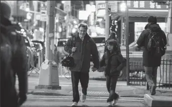 ?? ?? Woody Norman and Joaquin Phoenix walk through the streets in C’mon C’mon