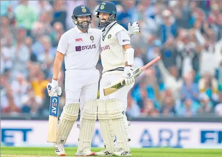  ??  ?? Rohit Sharma (L) and Cheteshwar Pujara stitched together a 153-run stand for the second wicket on Day 3 of the fourth Test at the Oval on Saturday.