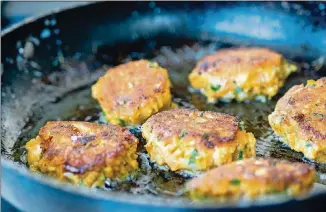  ?? CONTRIBUTE­D BY HENRI HOLLIS ?? The sweet potato fritters are pan-fried til they have a golden, crunchy crust.