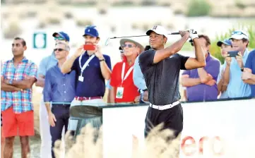  ?? — AFP photo ?? Tiger Woods of the United States plays his shot from the 14th tee during the first round of the Hero World Challenge at Albany, Bahamas on November 30, 2017 in Nassau, Bahamas.