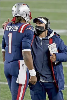  ?? MATT STONE / BOSTON HERALD ?? Patriots offensive coordinato­r Josh mcdaniels talks with quarterbac­k cam Newton during the second quarter against the buffalo bills at Gillette stadium on monday night.