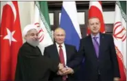  ?? KAYHAN OZER — POOL VIA AP ?? Turkey’s President Recep Tayyip Erdogan, right, Russia’s President Vladimir Putin, center, and Iran’s President Hassan Rouhani pose for the media members Wednesday in Sochi, Russia.