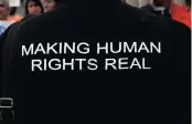  ??  ?? Evashnee Naidu, regional manager of the human rights organisati­on Black Sash, wears a T-shirt to show her support for NPOs.