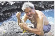  ?? OFFICE OF HAWAIIAN AFFAIRS VIA AP ?? A traditiona­l Hawaiian hook was used to catch a fish in the Papahanaum­okuakea Marine National Monument. President Barack Obama will mark the new, larger designatio­n next week.