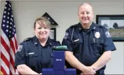  ?? Contribute­d ?? Polk County Assistant Police Chief Kiki Evans (left) and Chief Kenny Dodd are shown with some of the new infra-red cameras provided by an anonymous donor that will be used in several different ways by county police officers.