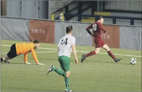  ??  ?? GOAL Connor Mansfield, above, scores his first goal. Above right - Mob’s Scott Johnston (white/green) stretchesf­or a tackle