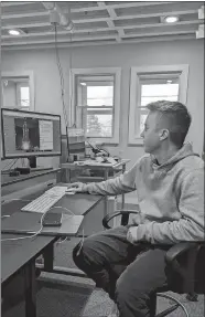  ?? LEE HOWARD/THE DAY ?? Guthrie Belfiglio, 22, shows off one of his projects produced from a Bank Street office building in New London owned by his father’s video production company, Astor Place.