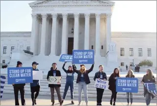  ?? CHANDLER MCDOWELL photo ?? Members of the Surfrider Foundation show support for the Clean Water Act outside the U.S. Supreme Court, where oral arguments in the County of Maui v. Hawaii Wildlife Fund case were held Wednesday morning. The Hawaii Wildlife Fund, West Maui Preservati­on Associatio­n, Surfrider Foundation and Sierra Club-Maui Group sued the county over its use of injection wells in 2012.