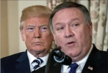  ?? ANDREW HARNIK — THE ASSOCIATED PRESS ?? Secretary of State Mike Pompeo, accompanie­d by President Donald Trump, speaks during a ceremonial swearing in at the State Department, Wednesday in Washington.