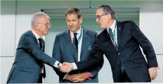  ?? Photo / Getty Images ?? NZR chairman Brent Impey greets NZ’s ambassador to Japan Hamish Cooper at the 2019 Rugby World Cup as chief executive Mark Robinson watches.