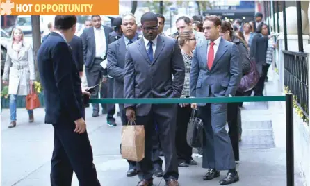  ?? — Reuters ?? Job seekers stand in line to meet with prospectiv­e employers at a career fair in New York City.