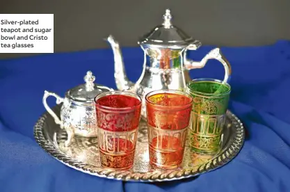  ??  ?? Silver-plated teapot and sugar bowl and Cristo tea glasses