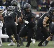  ?? MATT SLOCUM — ASSOCIATED PRESS FILE ?? Army quarterbac­k Kelvin Hopkins Jr. drops back during the first half of the team’s game against Navy in Philadelph­ia last December.