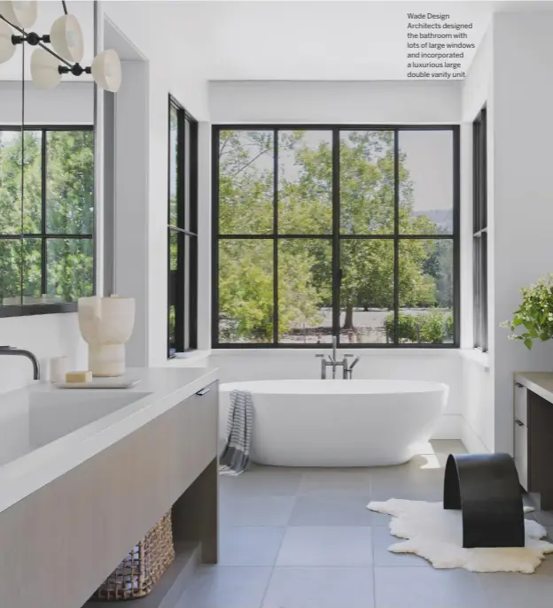  ??  ?? Wade Design Architects designed the bathroom with lots of large windows and incorporat­ed a luxurious large double vanity unit