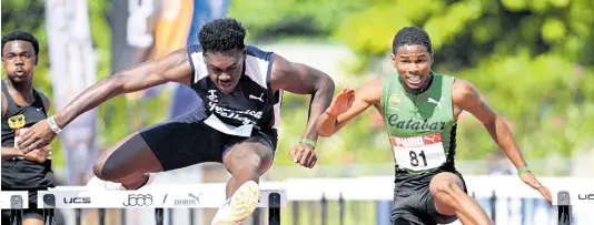  ?? FILE ?? Zacre Braham (right) of Calabar High wins his Class One 110m hurdles heat in 14.46 seconds ahead of Joshua Edwards of Jamaica College at the recent McKenley-Wint Classics at Calabar.