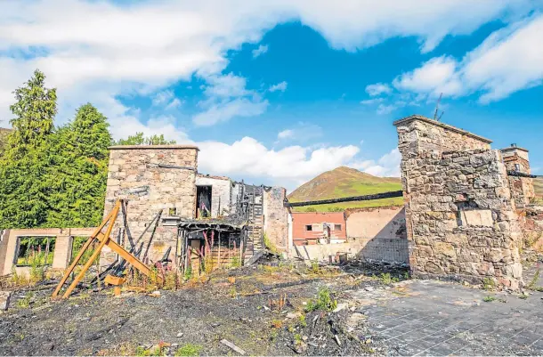  ??  ?? DILAPIDATE­D: The ruins of the Spittal of Glenshee Hotel – the hotel had been popular with tourists and skiers. Picture by Steve Macdougall.