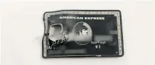  ??  ?? Riaz Mamdani’s American Express card, made of titanium and carried in his suit vest pocket, was ruptured by a bullet in this evidence photo.