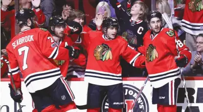  ??  ?? Patrick Kane ( second from right) and Nick Schmaltz ( right) already have shown they play well together. | JONATHAN DANIEL/ GETTY IMAGES