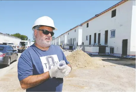  ?? NICK BRANCACCIO ?? Developer Jim Liovas talks Thursday about a new $20-million housing developmen­t for migrant workers in Leamington. Constructi­on started nearly a year ago on what’s being touted as a private-sector solution to better accommodat­e workers and keep them healthy on local farms.