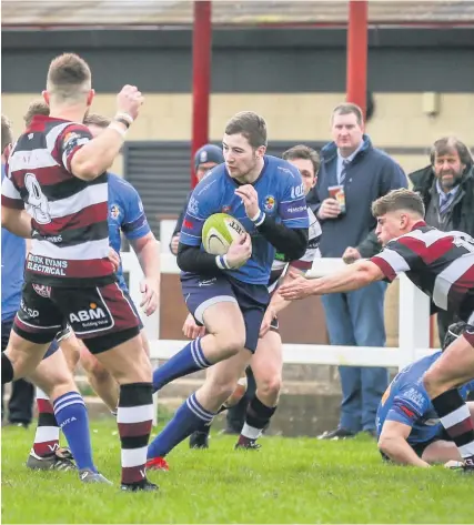  ?? Picture: James Beck ?? Action from the game between Cleve, in white and red, and Weston-super-Mare, in blue