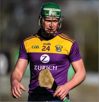  ??  ?? Conor McDonald is all alone in this photograph taken during the league game against Carlow - but that is the exception rather than the rule on a hurling field where constant contact is unavoidabl­e.