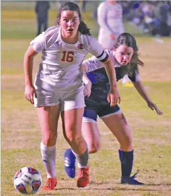  ?? STAFF PHOTO BY PATRICK MACCOON ?? Signal Mountain senior midfielder Lucy Calhoun gets past a defender in Wednesday’s Class A state quarterfin­al victory over Madison Magnet at the Richard Siegel Soccer Complex in Murfreesbo­ro.