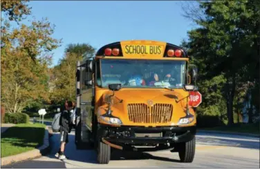 ?? SUBMITTED PHOTO ?? A Krapf school bus stops to pick up students on their way to Starkweath­er Elementary School.