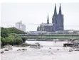  ?? FOTO: DPA ?? Zwei Wahrzeiche­n von Köln: Dom und Rhein.