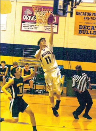  ?? MARK HUMPHREY ENTERPRISE-LEADER ?? Lincoln scored several unconteste­d layups such as this one by Dalton Barnum during their 76-49 win over Haas Hall at the Decatur Holiday Classic basketball tournament on Dec. 2.