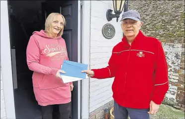  ?? ?? Neal Morcom delivering post to Liz Chittim in Wingham