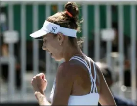  ?? TONY AVELAR — THE ASSOCIATED PRESS ?? Mihaela Buzarnescu, of Romania, reacts after scoring a point against Maria Sakkari, of Greece, during the finals of the Mubadala Silicon Valley Classic tennis tournament in San Jose Sunday.