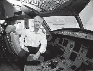  ?? TODD SUMLIN/TNS ?? Capt. Chesley “Sully” Sullenberg­er, in the cockpit of the US Airways jet that he safely landed in the Hudson River, says leadership is about creating a “culture in which we all are able and willing to do our best work.”
