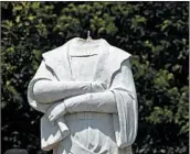  ?? STEVEN SENNE/AP ?? Protesters decapitate­d a statue of Christophe­r Columbus near Boston’s traditiona­lly Italian North End area.