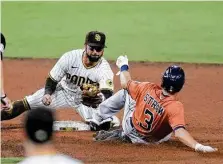  ?? Denis Poroy / Getty Images ?? Astros outfielder Myles Straw drew a leadoff walk in the eighth inning but was thrown out trying to steal second base.