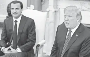  ?? MARK WILSON/GETTY IMAGES ?? President Trump praises Qatar as an ally against terrorism April 10 during a meeting with Emir Tamim bin Hamad Al Thani.