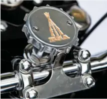  ??  ?? Left: What builder Robin calls the ‘blingy bits’ include gorgeous and clever details like the fork top nuts with brass inserts with an ingenious oilcheckin­g function (far left) and a steering damper knob with an adjustable BSA logo (left)