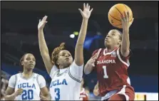  ?? Associated Press ?? Oklahoma guard Nevaeh Tot (1) shoots over UCLA guard Londynn Jones (3) during the first half of a second-round NCAA Tournament game, Monday, in Los Angeles.